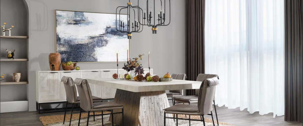 Stylish modern dining room with light wood table, chic chairs, and elegant decor.