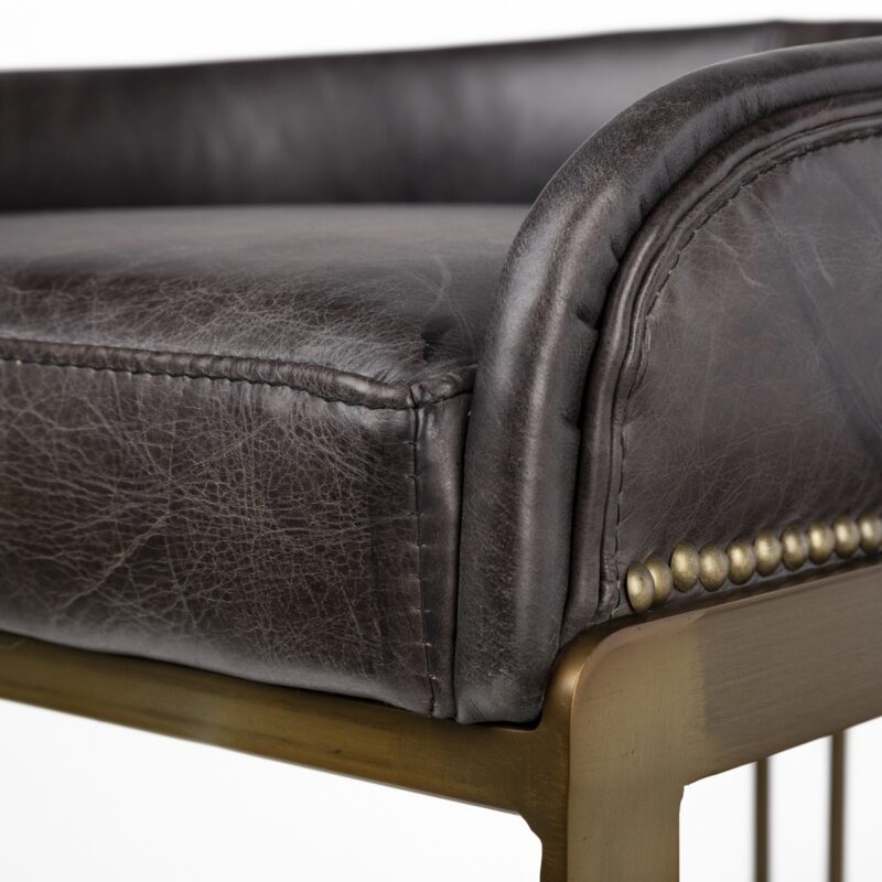Sophisticated leather accent chair with sleek metal frame, blending classic elegance and modern design.