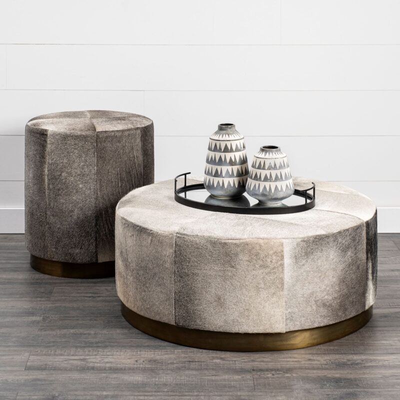 Chic living room featuring a modern ottoman set and stylish decor accents.