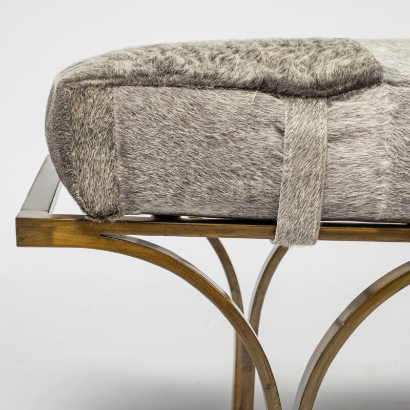 Contemporary gray fur cushion bench with elegant metal frame for stylish seating.