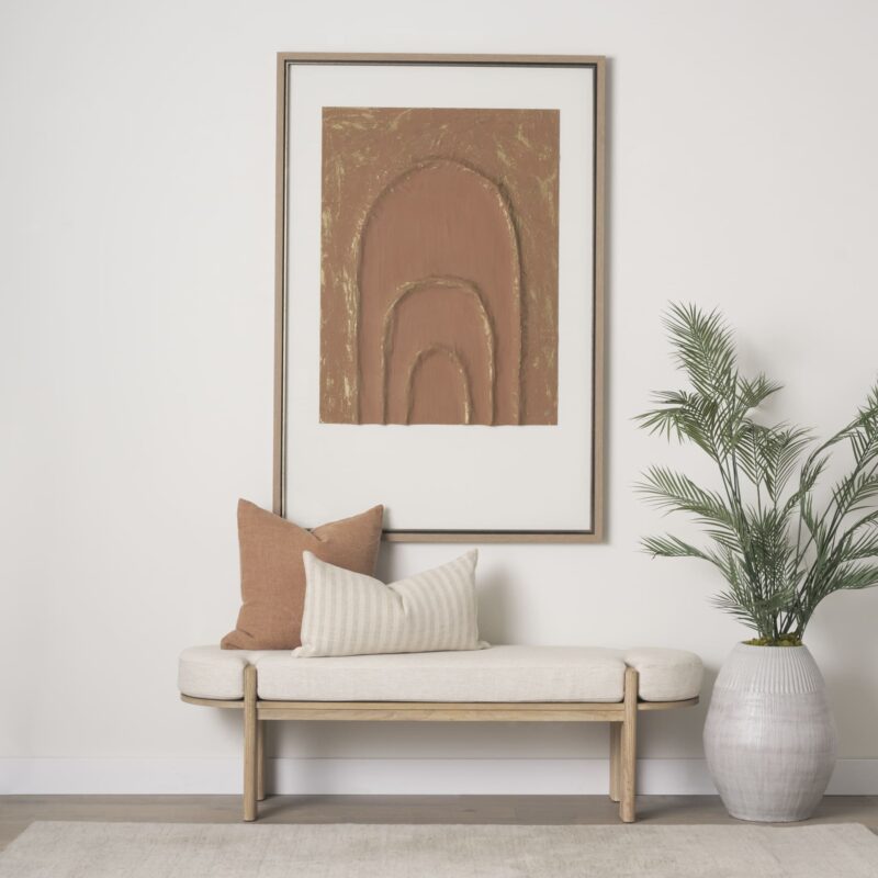 Serene minimalist interior with abstract art, wooden bench, and potted plant for inviting tranquility.