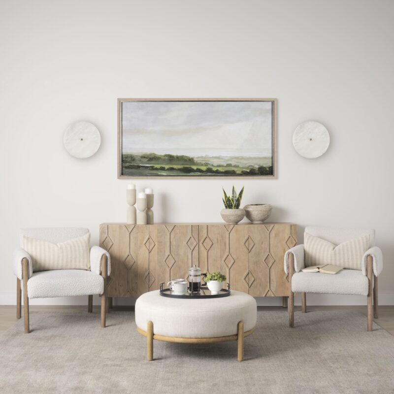 Tranquil minimalist living room featuring stylish furniture and soothing artwork.