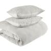 Elegant gray bedding set with plush duvet and pillows for a tranquil bedroom atmosphere.