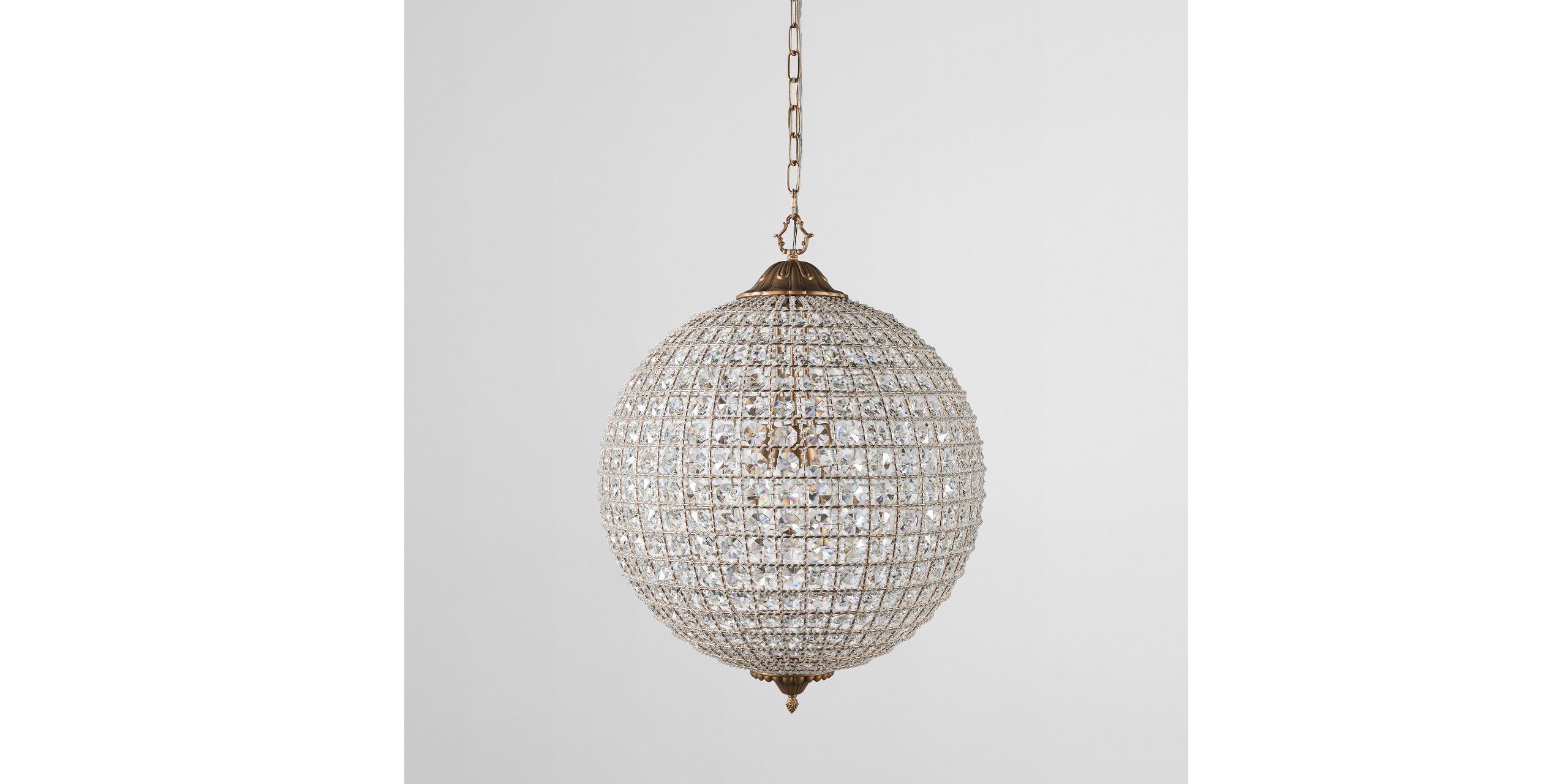 Stunning crystal globe chandelier elevates luxury spaces with elegant design and warm ambiance.