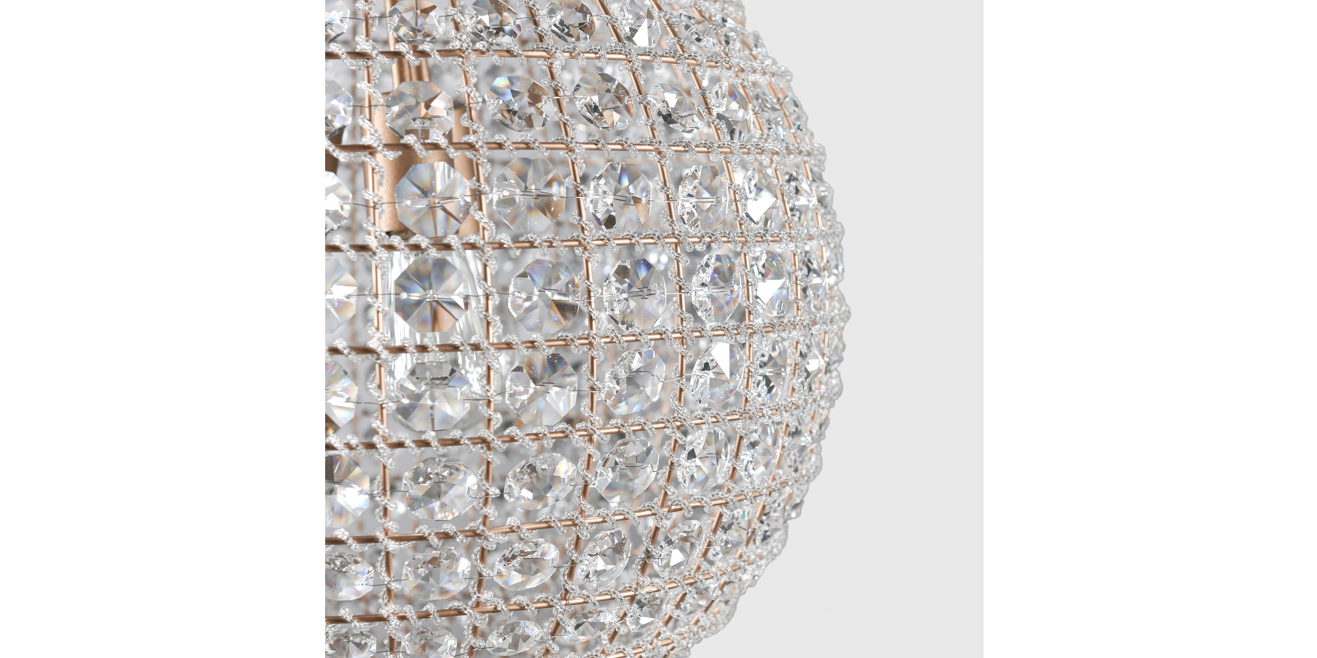 Elegant globe-shaped crystal chandelier enhancing sophisticated spaces with sparkling light reflections.