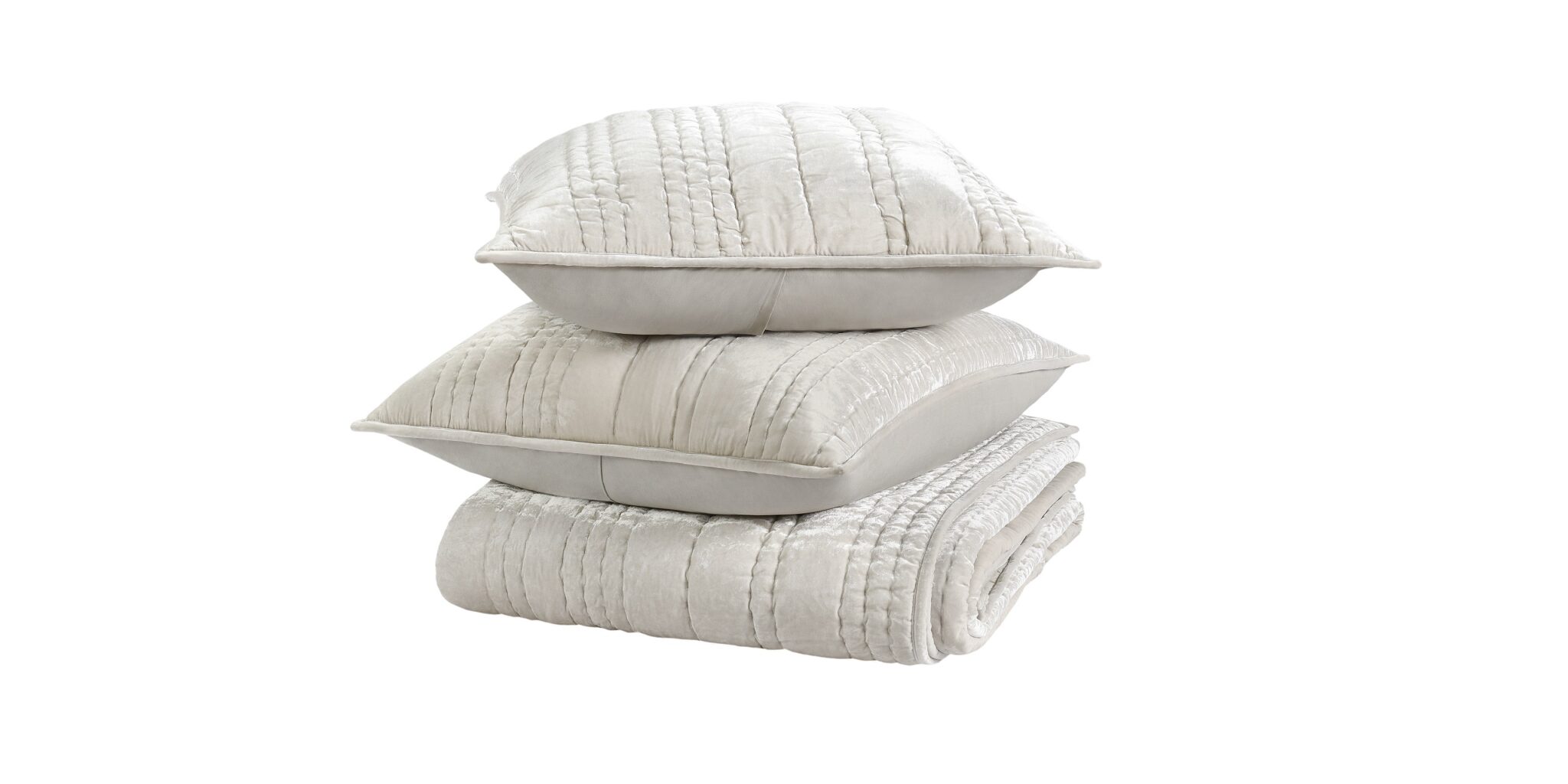 Elegant striped pillows atop a cozy blanket create a serene bedding display in soft tones.