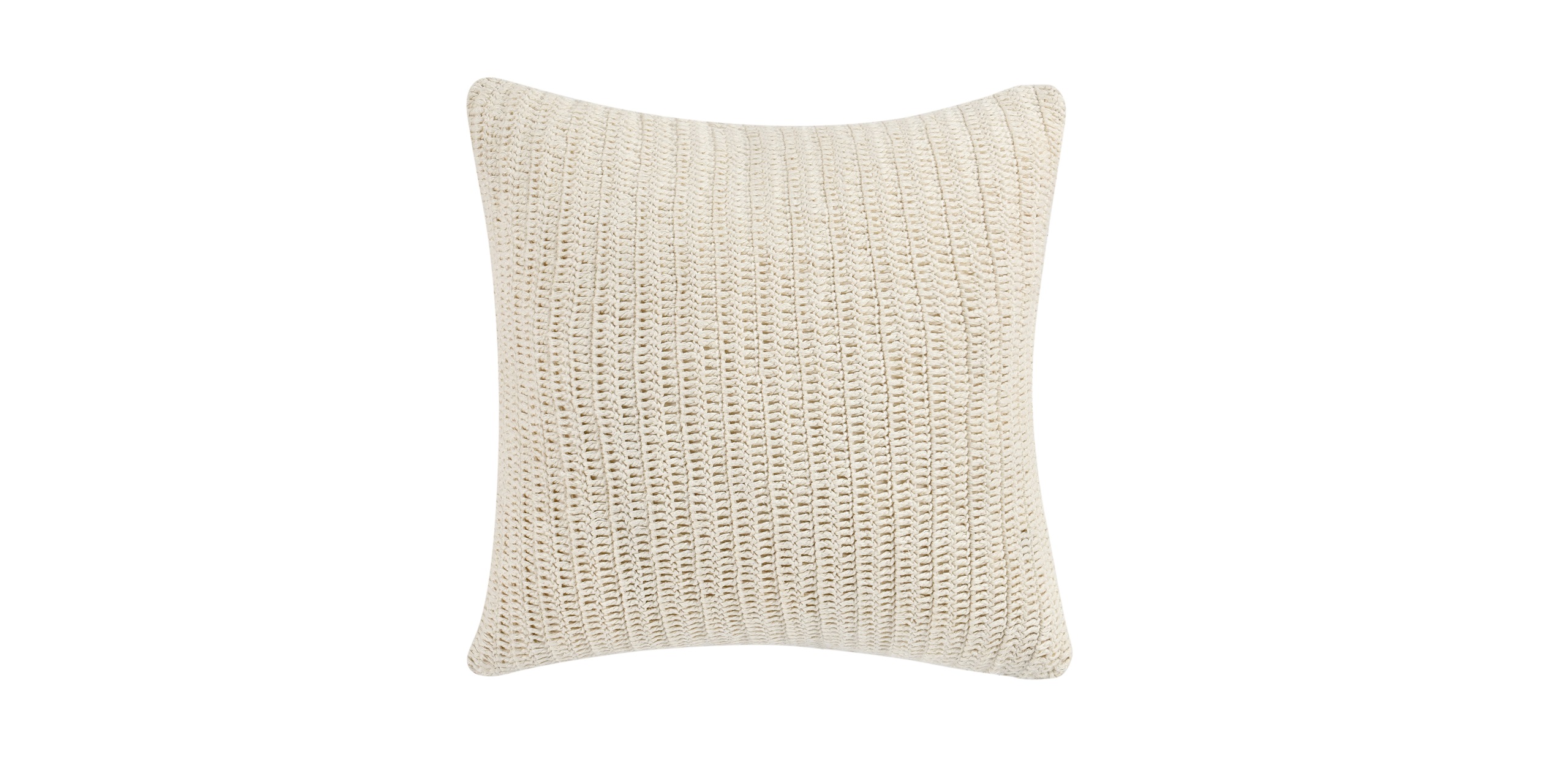 Cozy creamy white knitted pillow, perfect for enhancing modern or traditional interior decor.