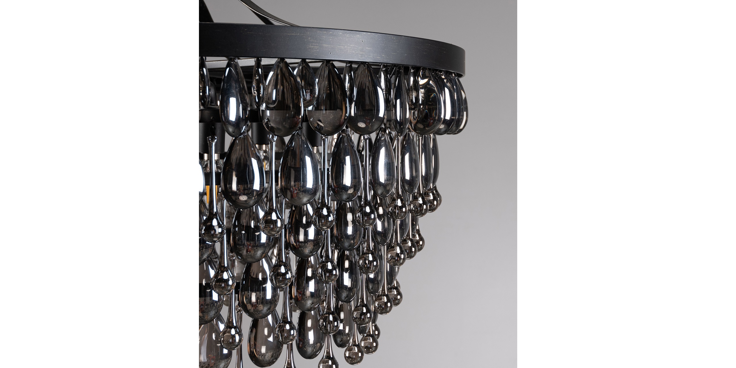 Sleek modern black chandelier with reflective glass droplets, perfect for stylish contemporary interiors.