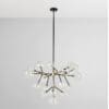 Modern chandelier with glass bulbs and brass accents, perfect for contemporary interior designs.