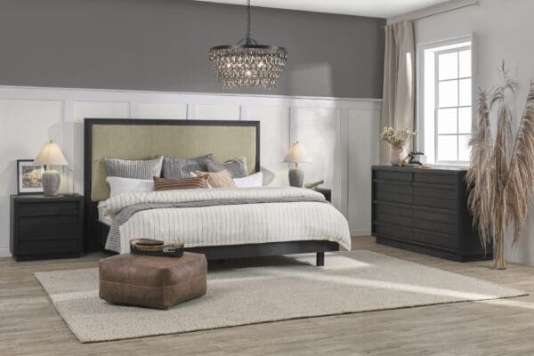 Elegant modern bedroom with cozy ambiance, featuring a green headboard, stylish nightstands, and sparkling chandelier.