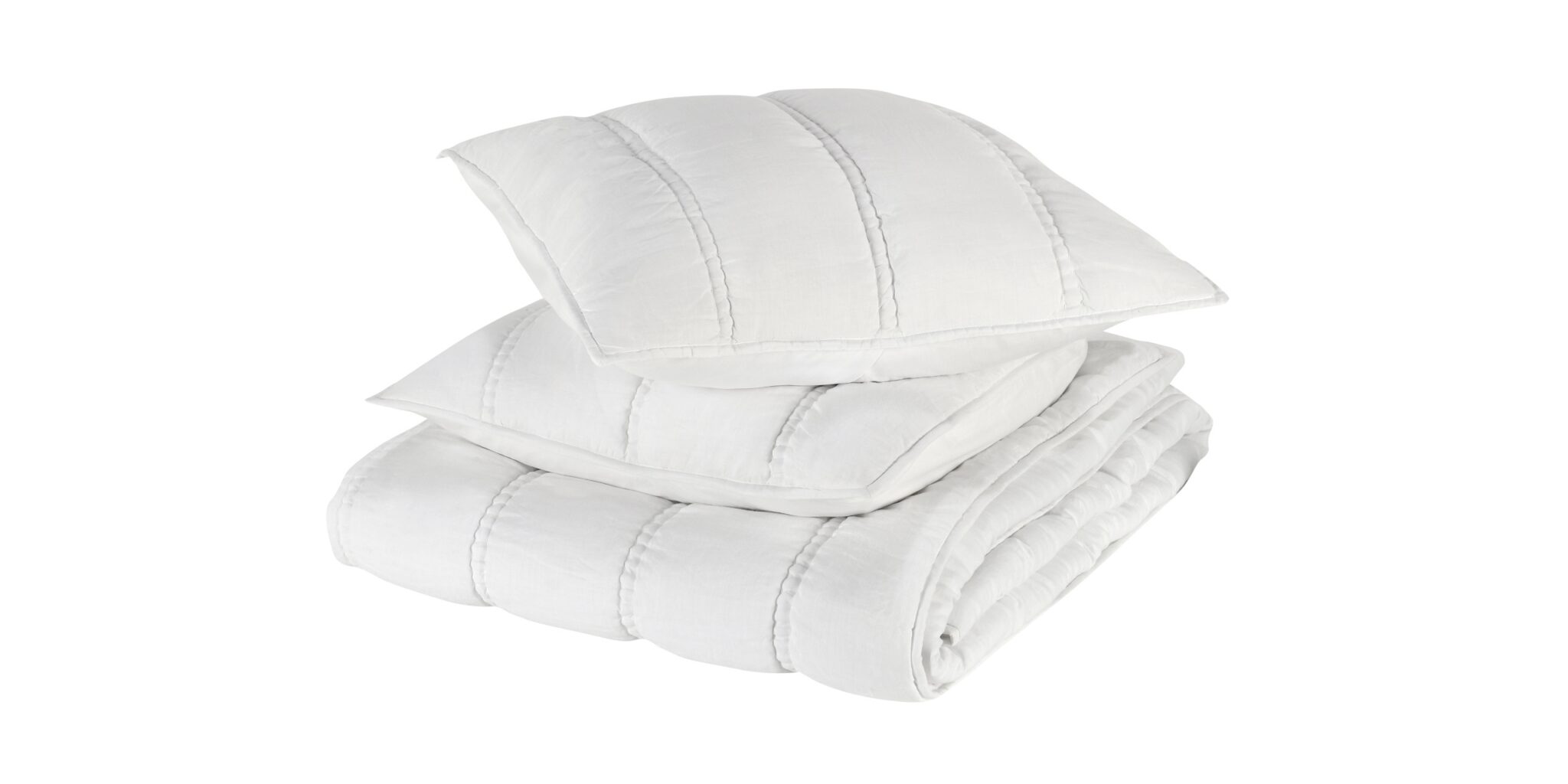 Elegant white bedding stack featuring quilted pillows and a plush comforter for a serene sleep.