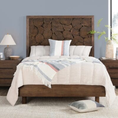 Cozy bedroom featuring a rustic wooden bed frame and serene pastel accents for elegant charm.