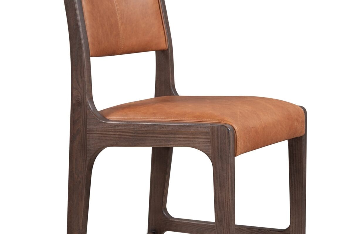 Stylish modern wooden dining chair with tan leather upholstery for comfort and elegance.