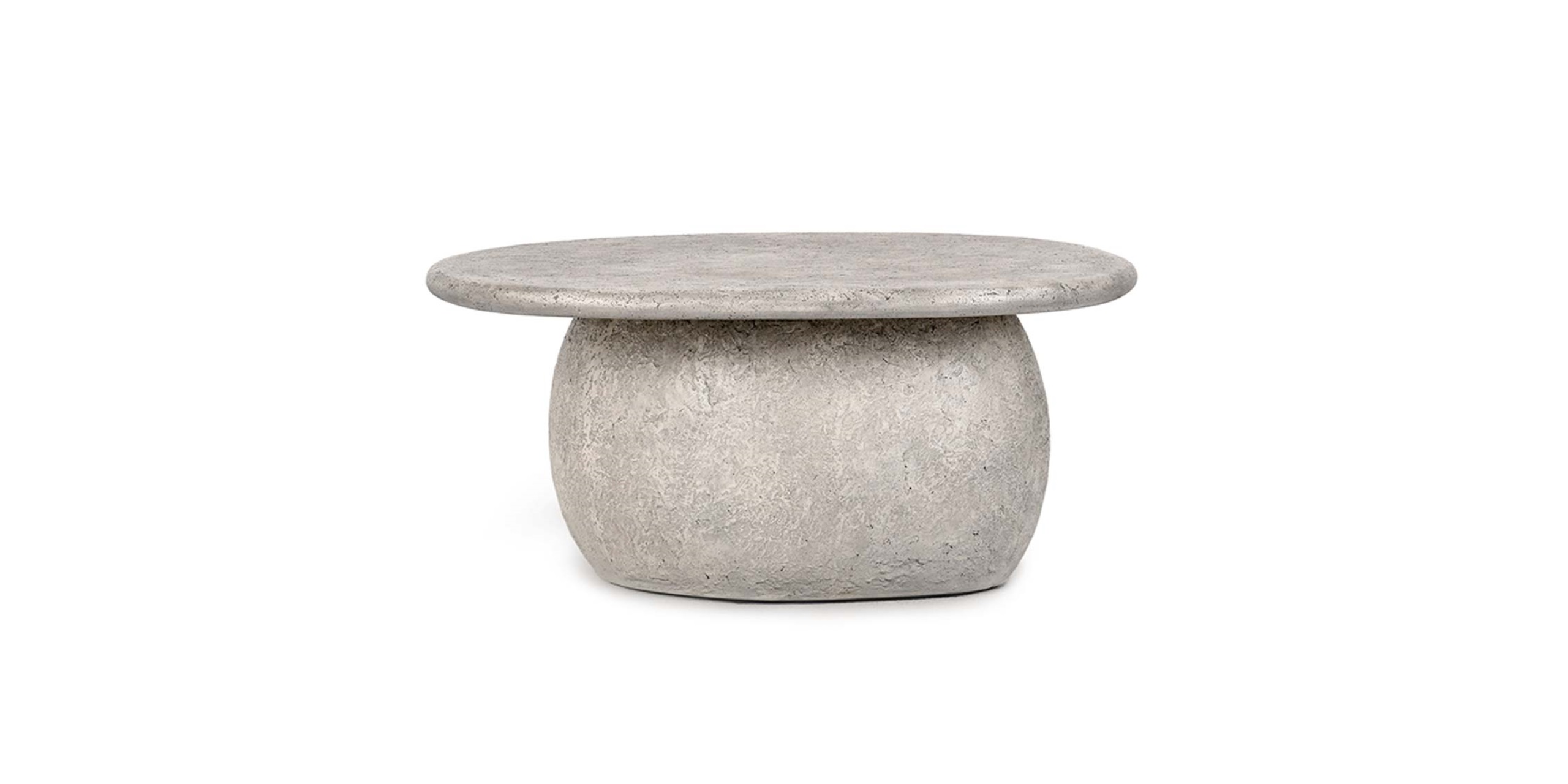 Sleek gray round side table with a textured surface, perfect for modern minimalist interiors.