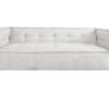 Contemporary beige sofa with tufted back, oversized sides, and dark wood legs for modern living spaces.