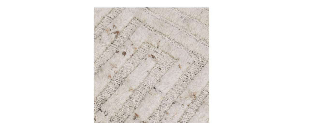 Stylish cream and beige chevron rug, perfect for adding warmth to any living space.