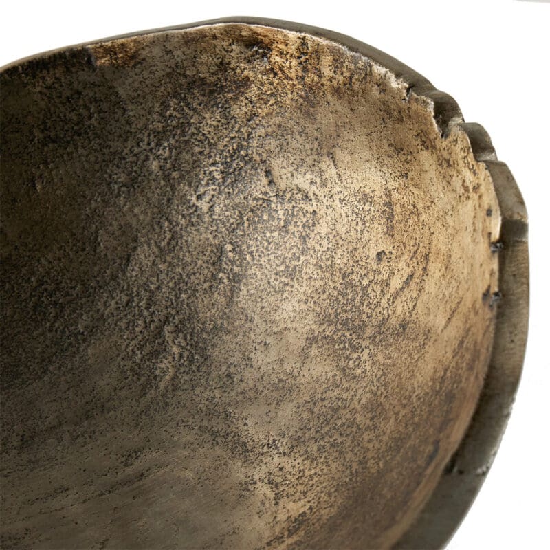 Artisan metal bowl showcasing unique patina, texture, and handcrafted imperfections for aesthetic and functionality.
