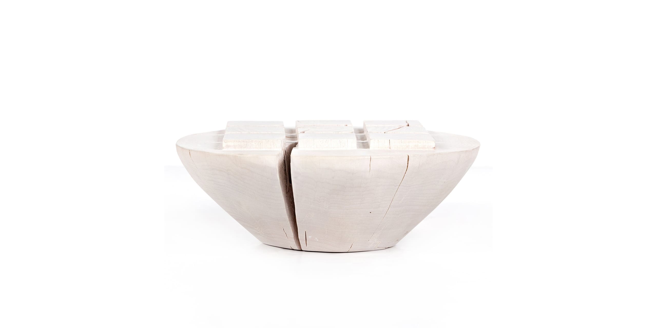 Contemporary ceramic bowl sculpture with elegant finish and striking vertical crack detail.