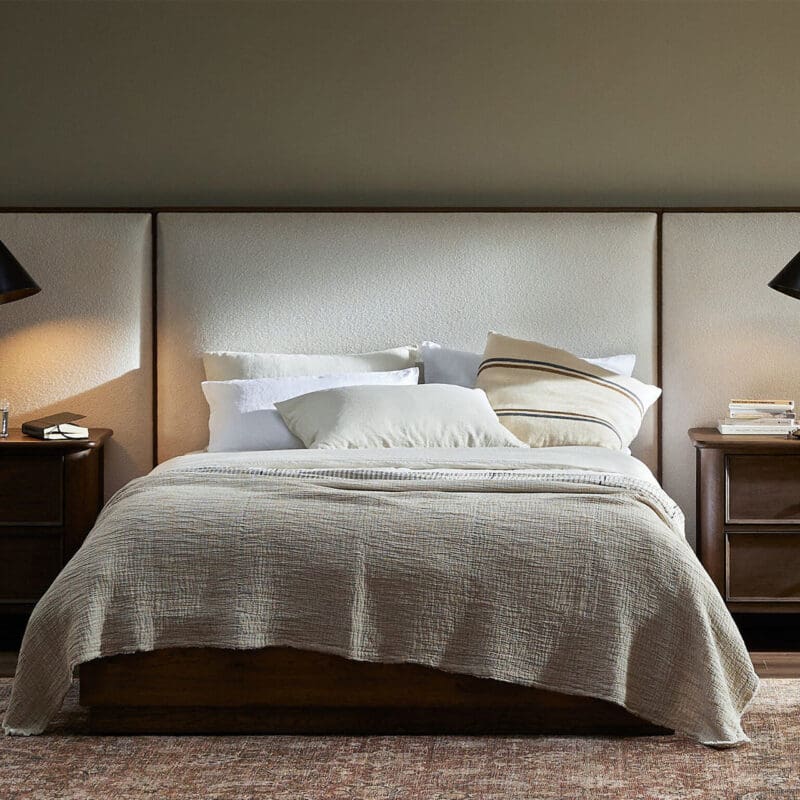 Elegant bedroom retreat with a classic wooden bed, soft bedding, and cozy ambiance.