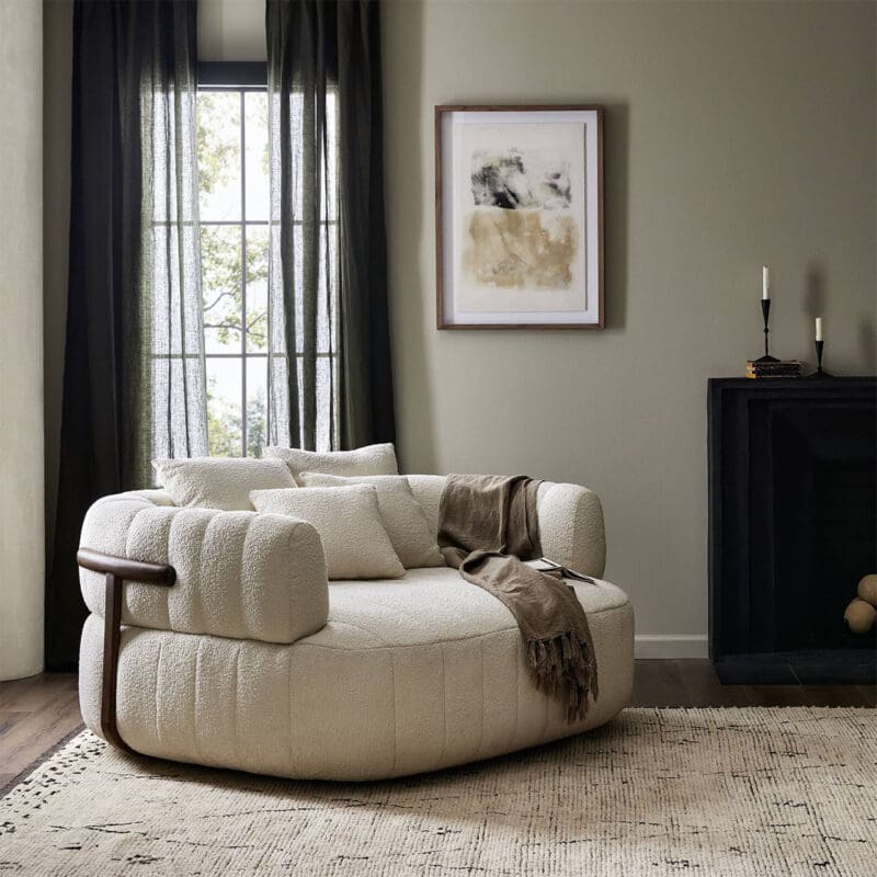 Stylish modern interior with a cozy armchair, natural light, and elegant decor accents.