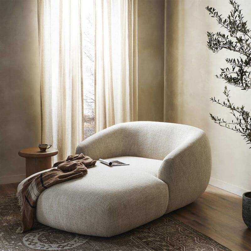 Stylish lounge chair with natural decor creates a cozy, minimalist living space.