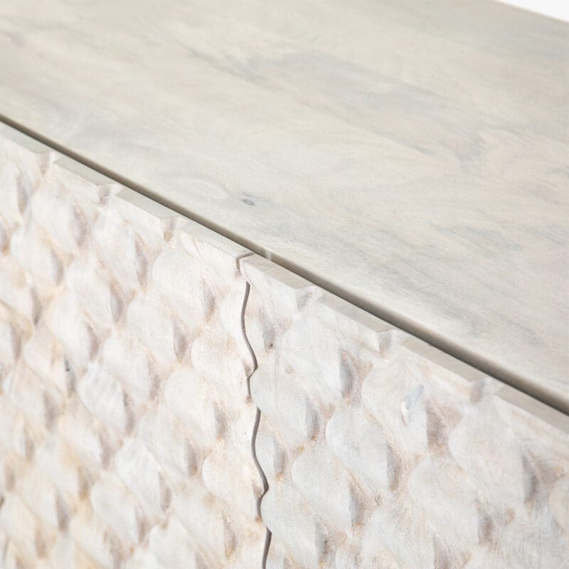 Elegant textured wood furniture featuring intricate geometric designs and a contemporary light color palette.