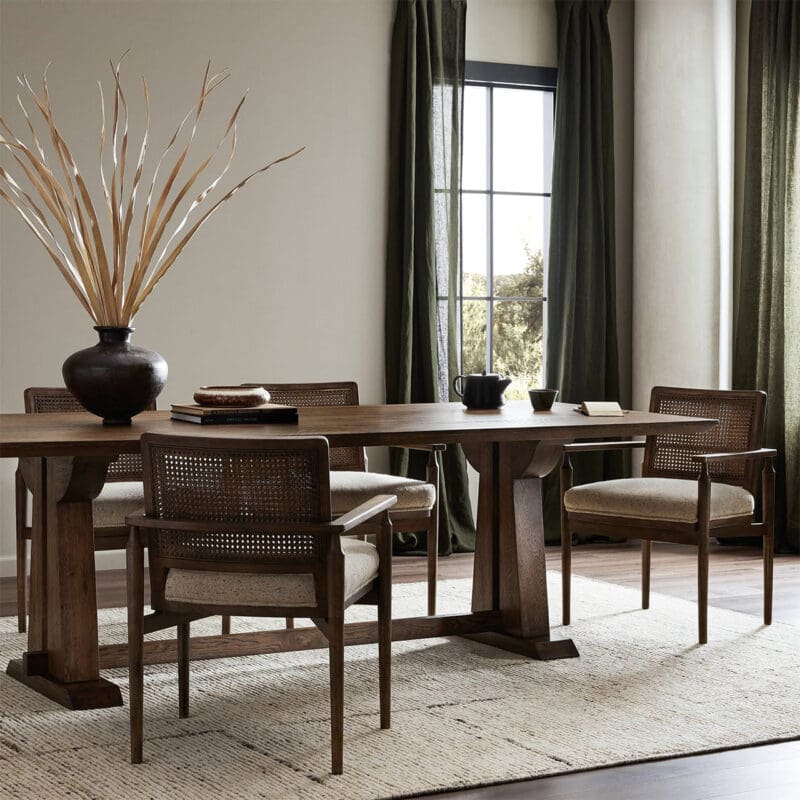 Stylish dining room with natural light, elegant wood table, chic chairs, and a captivating centerpiece.