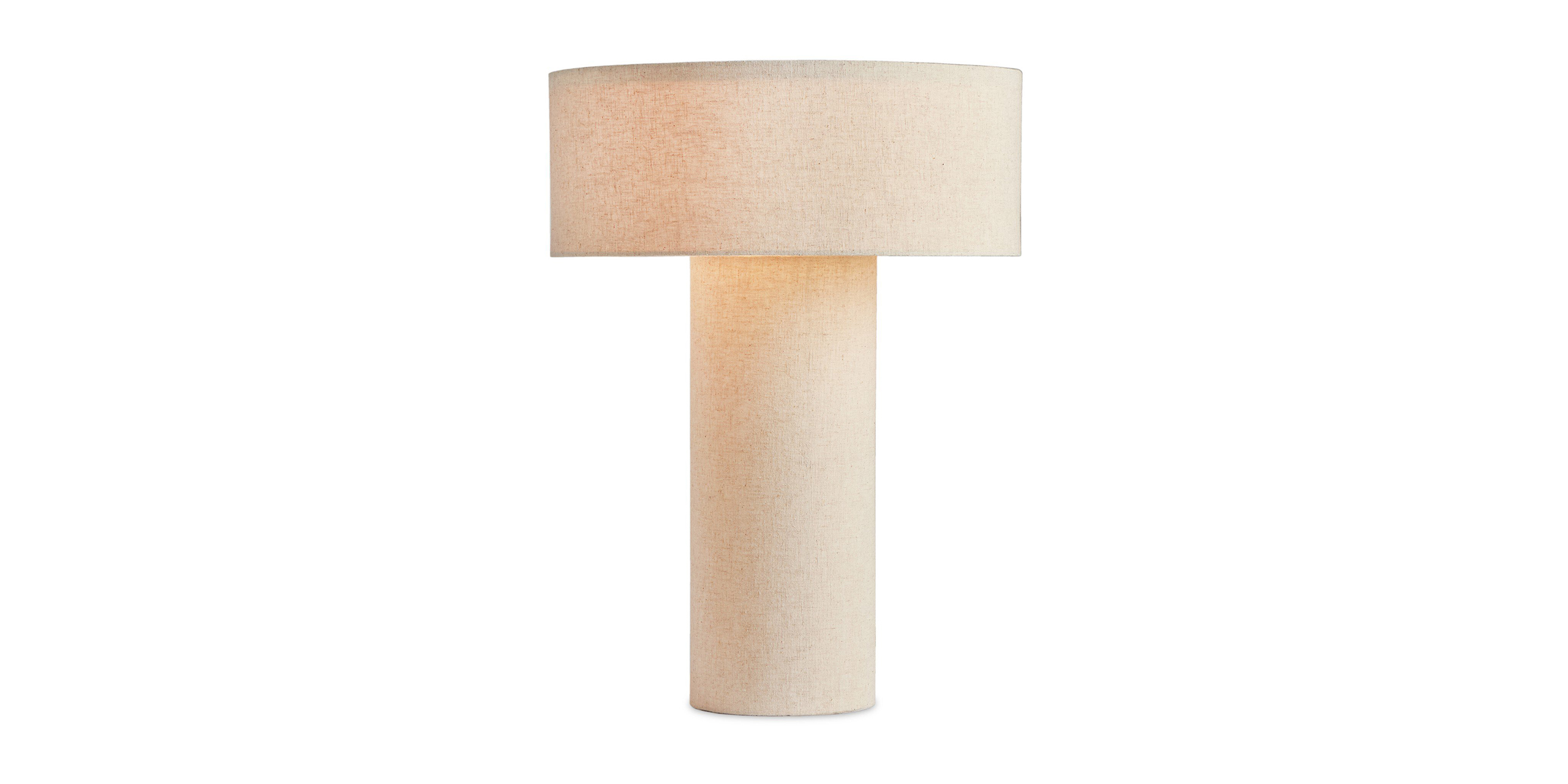 Stylish minimalist lamp with textured base and wide shade, perfect for cozy interiors.
