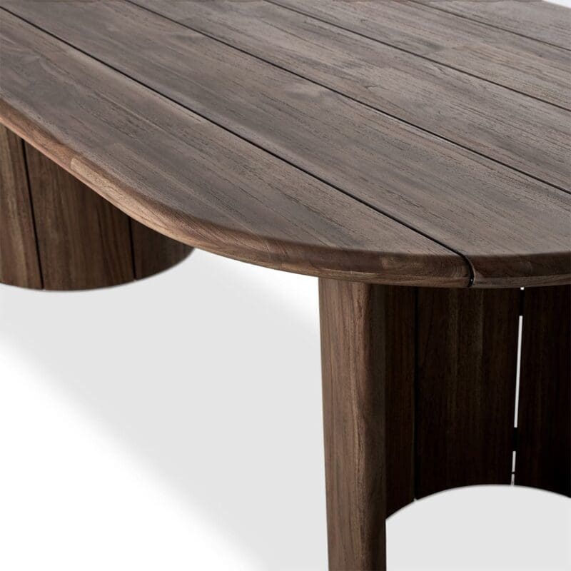 Elegant wooden dining table with organic curves, rich wood grain, and a smooth finish.