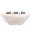 Handcrafted bowl with polished dark accents, merging minimalist design and functional beauty.