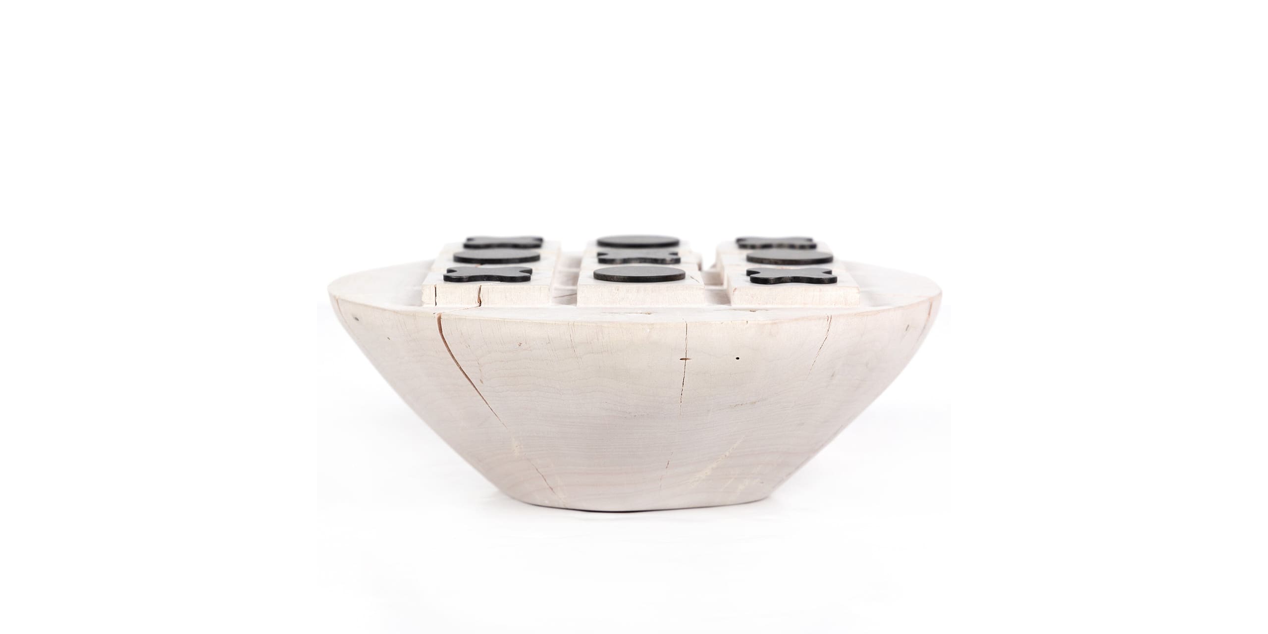 Handcrafted bowl with polished dark accents, merging minimalist design and functional beauty.