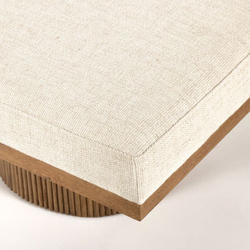 Minimalist cushion with textured fabric and ribbed wooden base, enhancing modern decor and comfort.