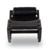 Chic modern black chaise lounge with leather upholstery and dark wood frame for elegant interiors.