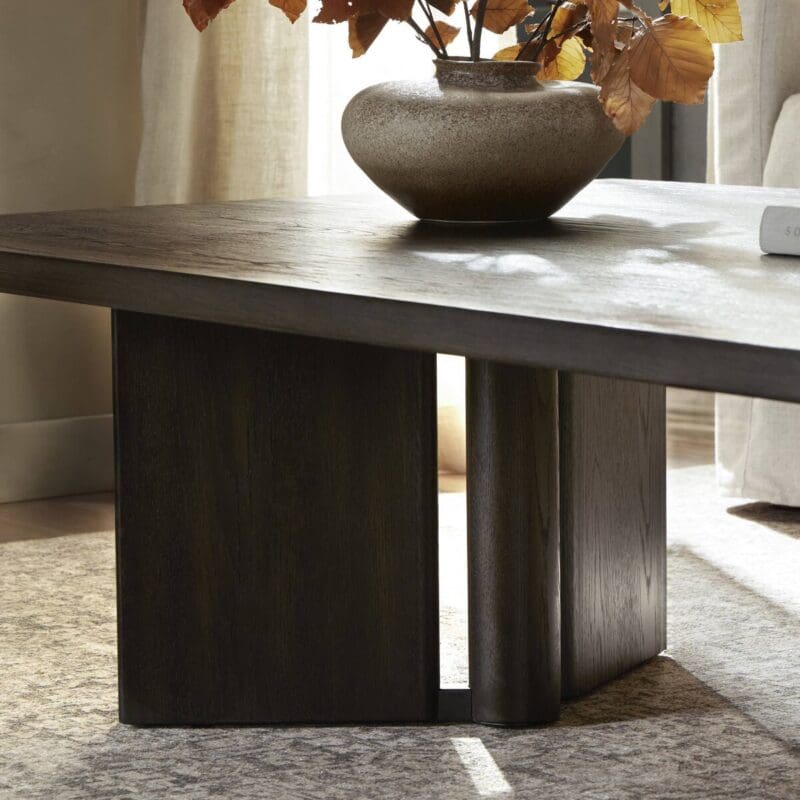 Modern coffee table with autumn leaves, creating a cozy and inviting living space.
