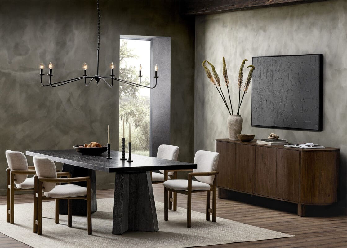 Elegant modern dining room with earthy tones, featuring a dark wood table and stylish chandelier.