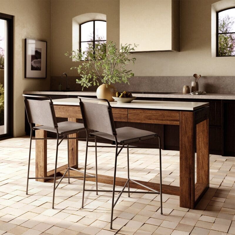 Stylish modern kitchen with wooden island, natural light, and inviting decor for social gatherings.