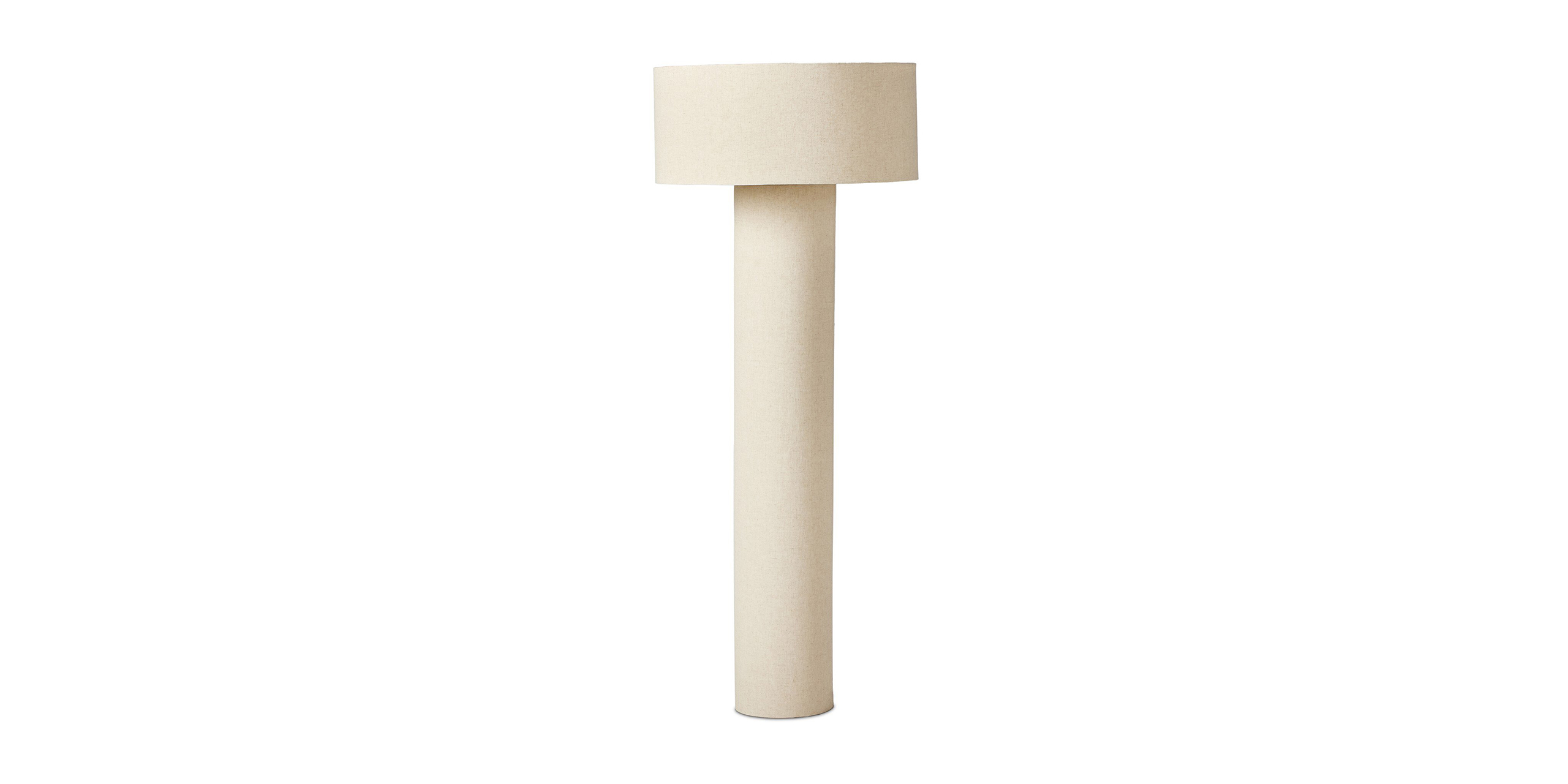 Sleek beige minimalist lamp with a sturdy base and wide shade, enhancing contemporary decor.