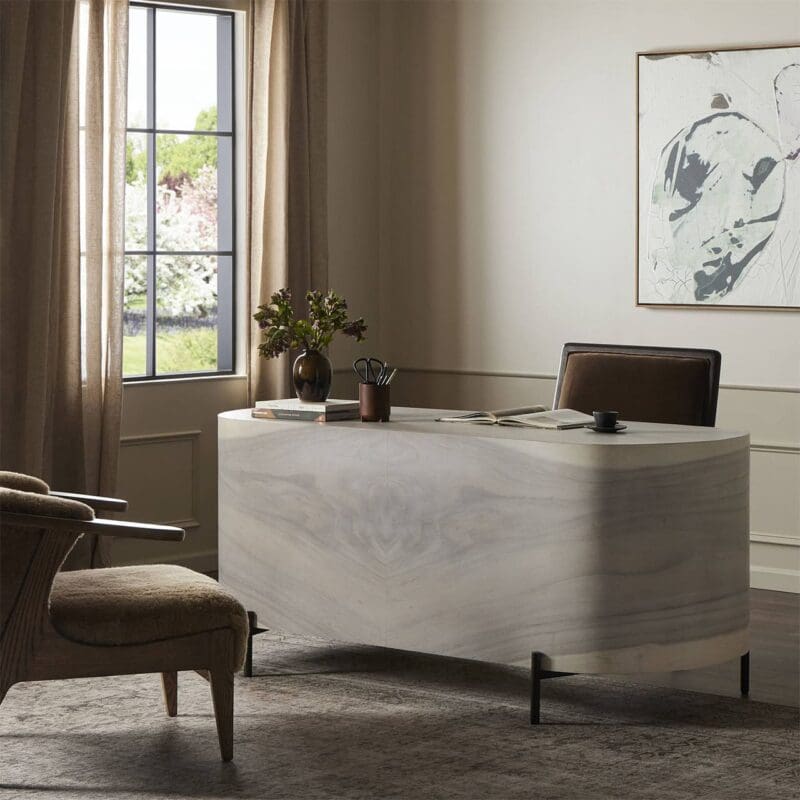 Elegant minimalist office with pale stone desk, comfortable chair, and serene natural light views.