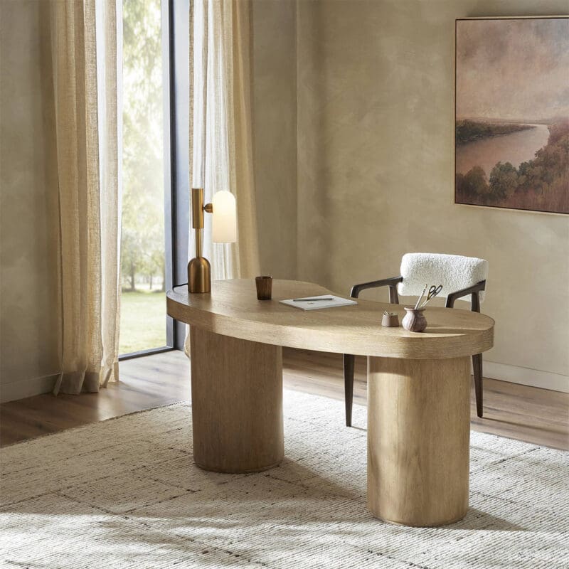 Modern office with light wood desk, minimalist chair, and natural light creating a serene atmosphere.