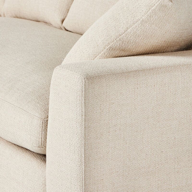Elegant modern sofa close-up showcasing comfort, minimalist design, and versatile beige upholstery.