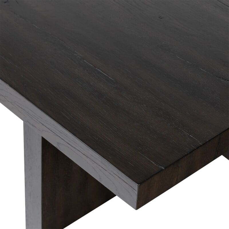 Sleek dark wood table with modern design and sturdy legs, perfect for any interior style.