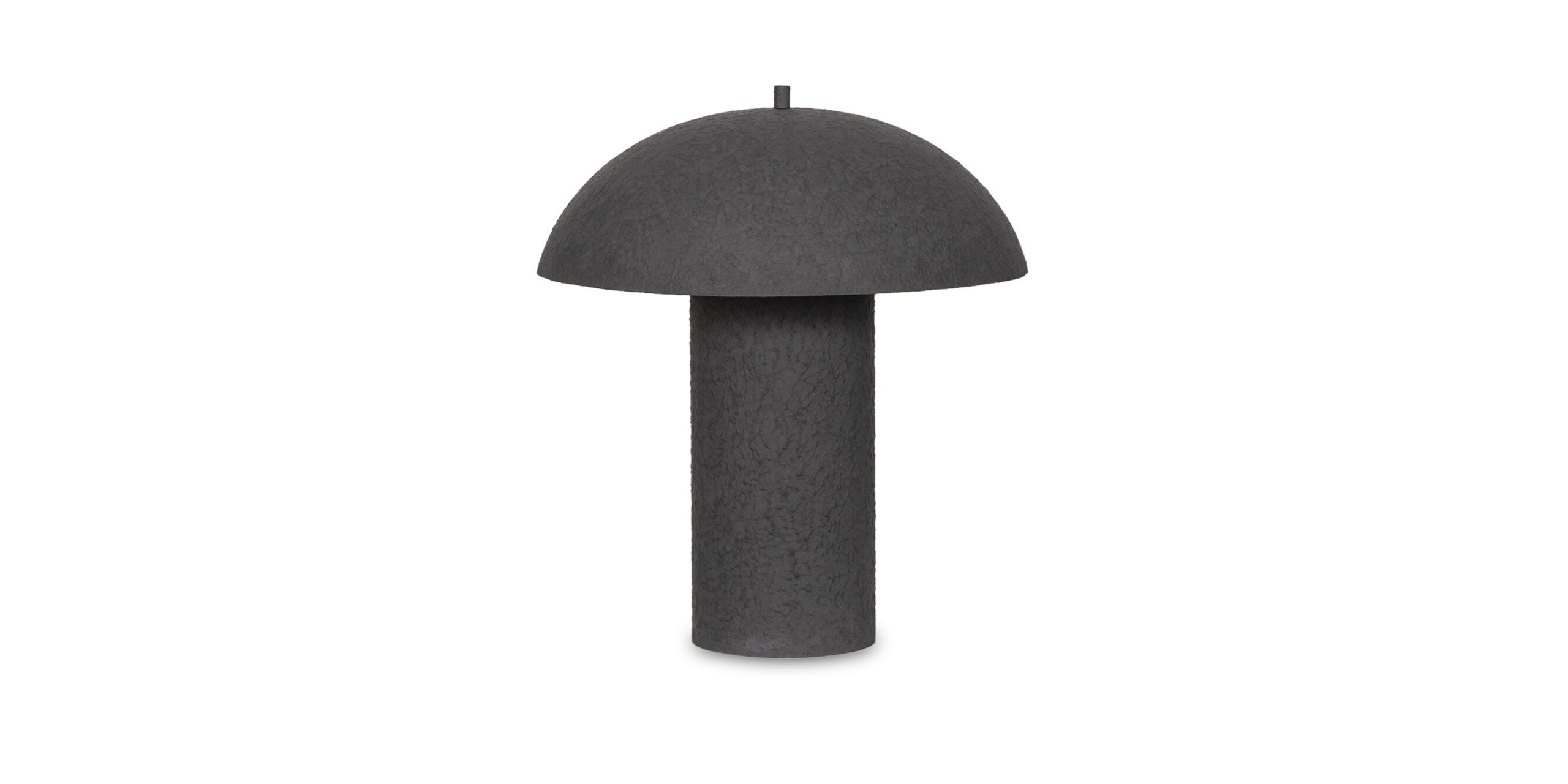 Stylish black mushroom lamp for contemporary interiors, perfect for ambient lighting and modern design.