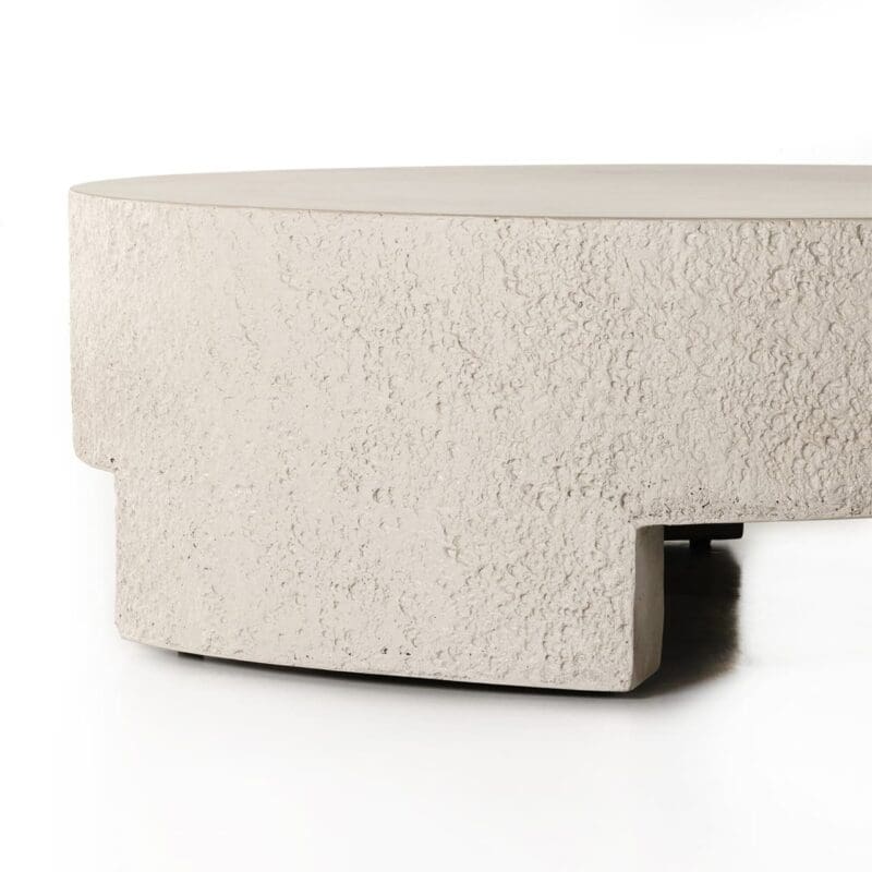 Elegant beige round coffee table with a textured surface, perfect for modern living spaces.