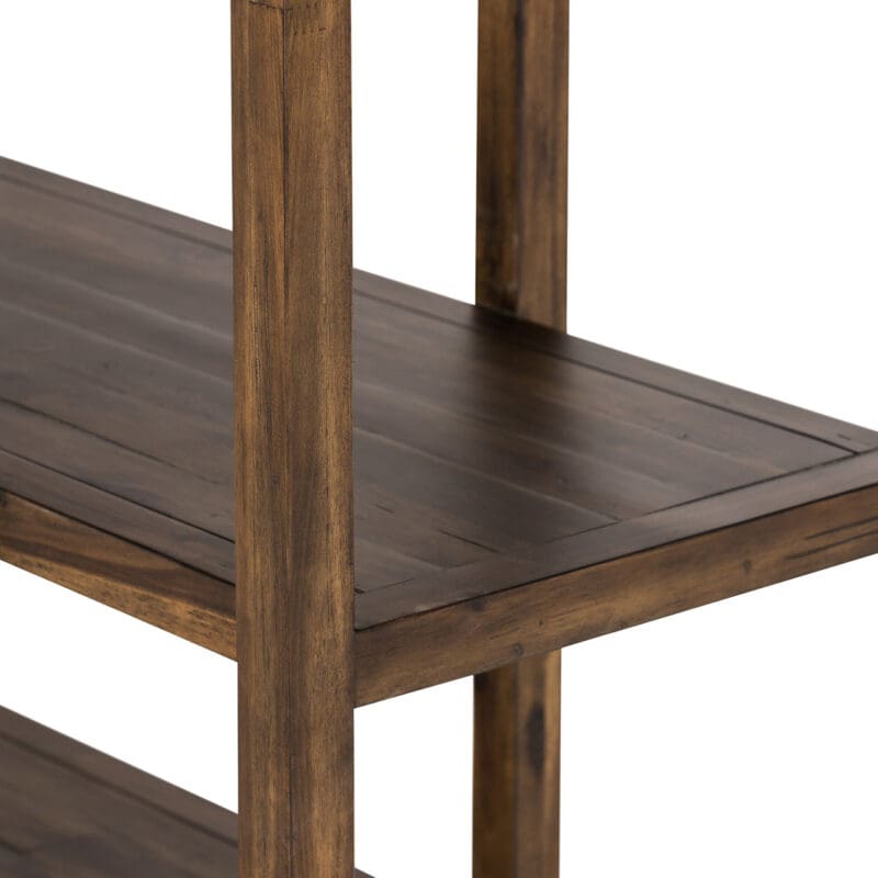 Durable rustic wooden shelving unit for stylish storage of books, decor, and kitchenware.