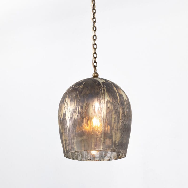 Elegant vintage-contemporary pendant light with aged metal shade, warm glow, and versatile design.
