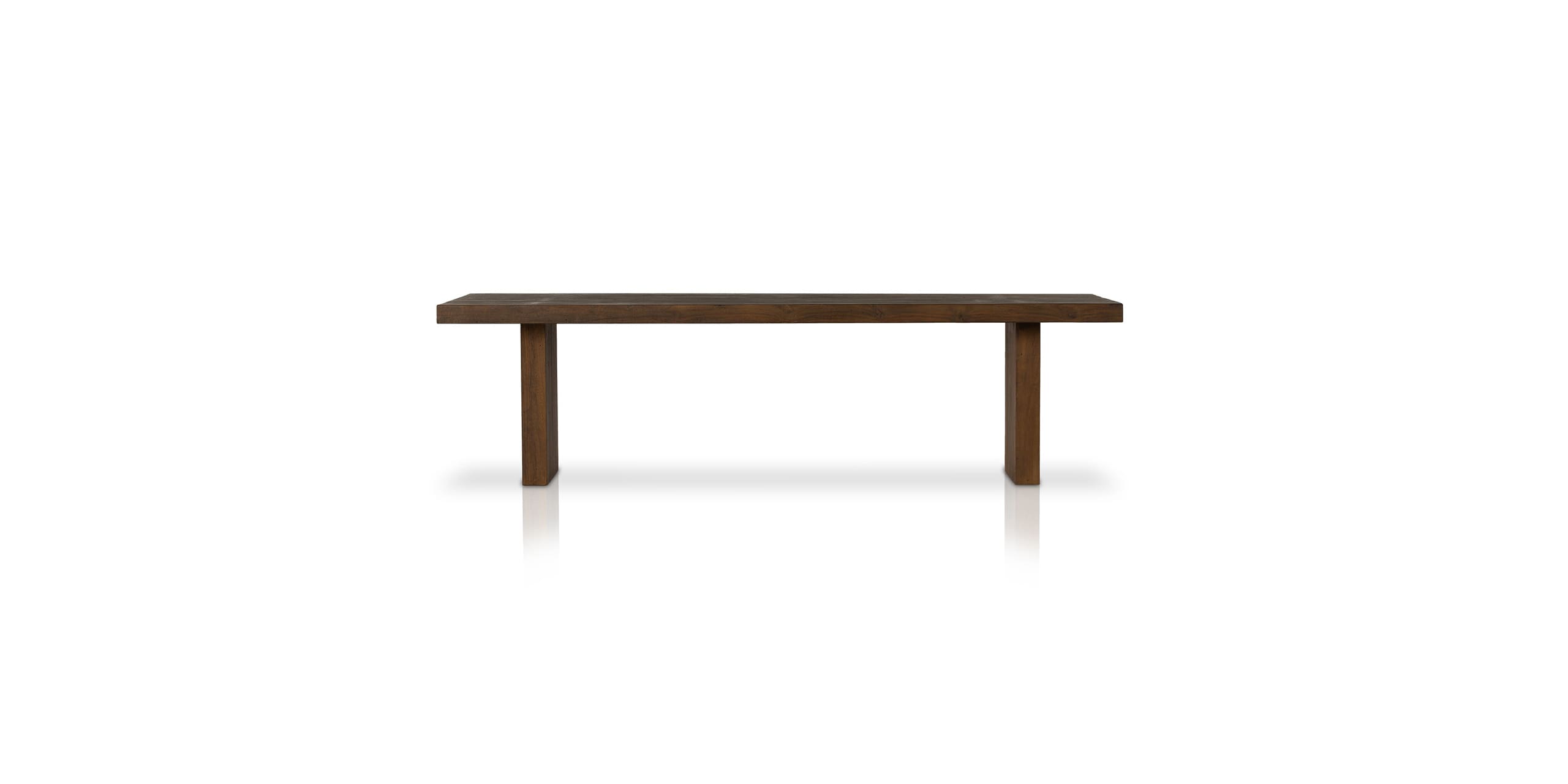 Minimalist wooden bench with dark finish, showcasing craftsmanship against a white background.