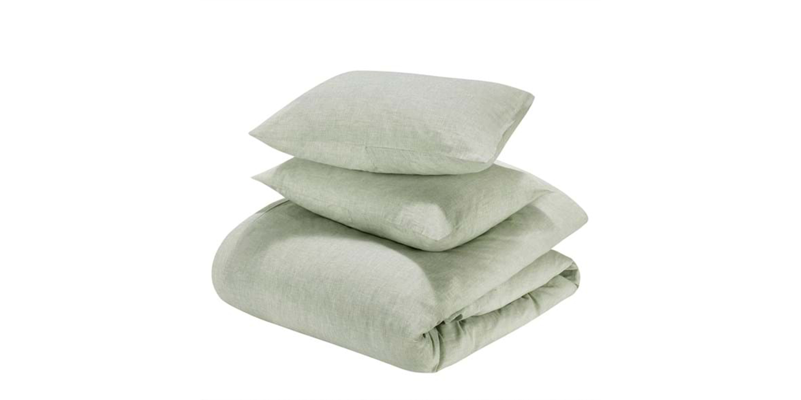 Cozy light green duvet and pillows for a tranquil bedroom atmosphere.