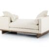 Stylish modern beige chaise lounge with minimalist design and inviting comfort for contemporary homes.