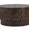 Elegant circular wooden coffee table with textured block design, ideal for modern living spaces.