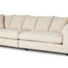 Stylish modern sofa in neutral beige with plush cushions and black metal frame for contemporary decor.